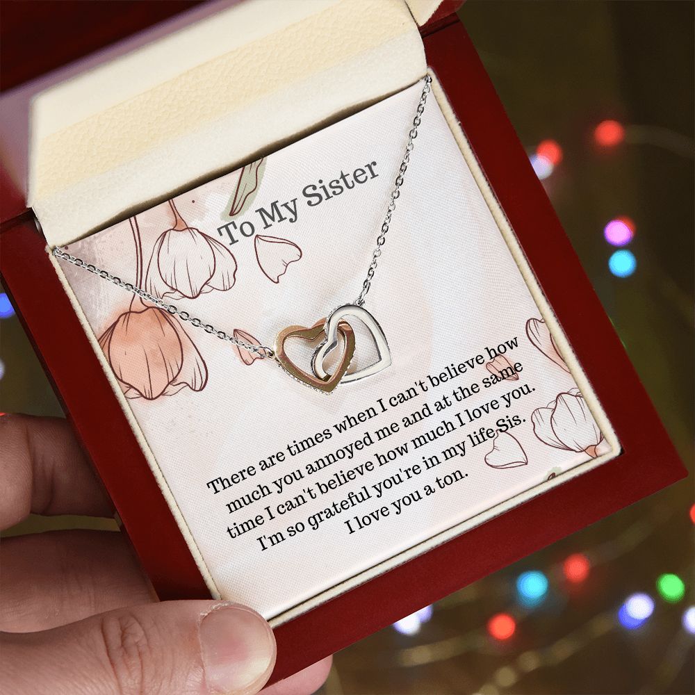 Sis.  To my Sister.  Interlocking hearts necklace